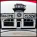 Interesting topmark of White Clock Hamburgers, showing building similar to other diners of that era with the addition of a coffee cup on top. 