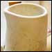 Bisque-fired handless creamer.